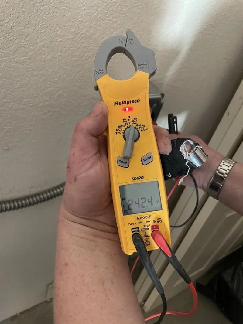 Voltage testing with clamp meter during Outlet Installation in Circleville